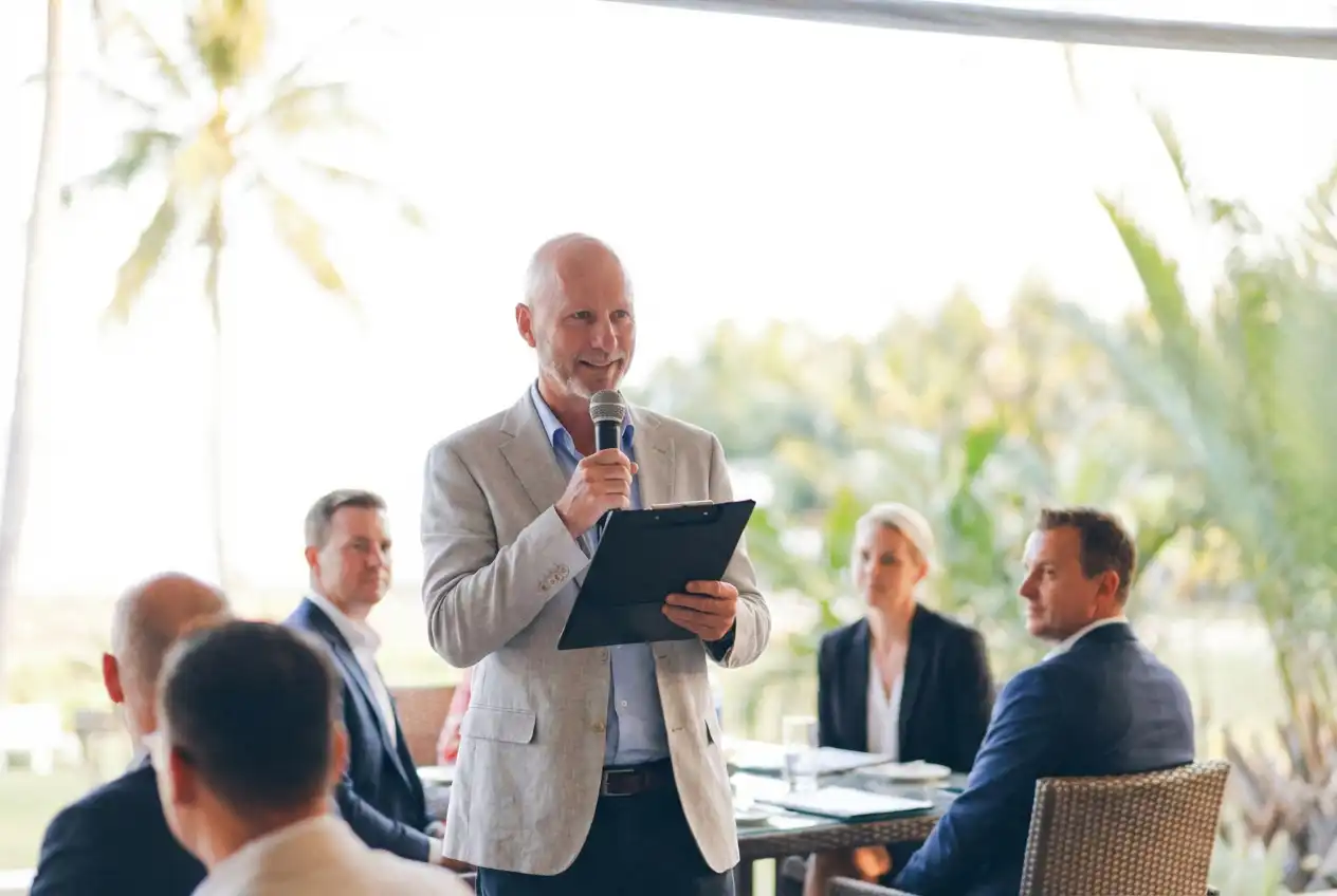 Jason Howes speaking at event